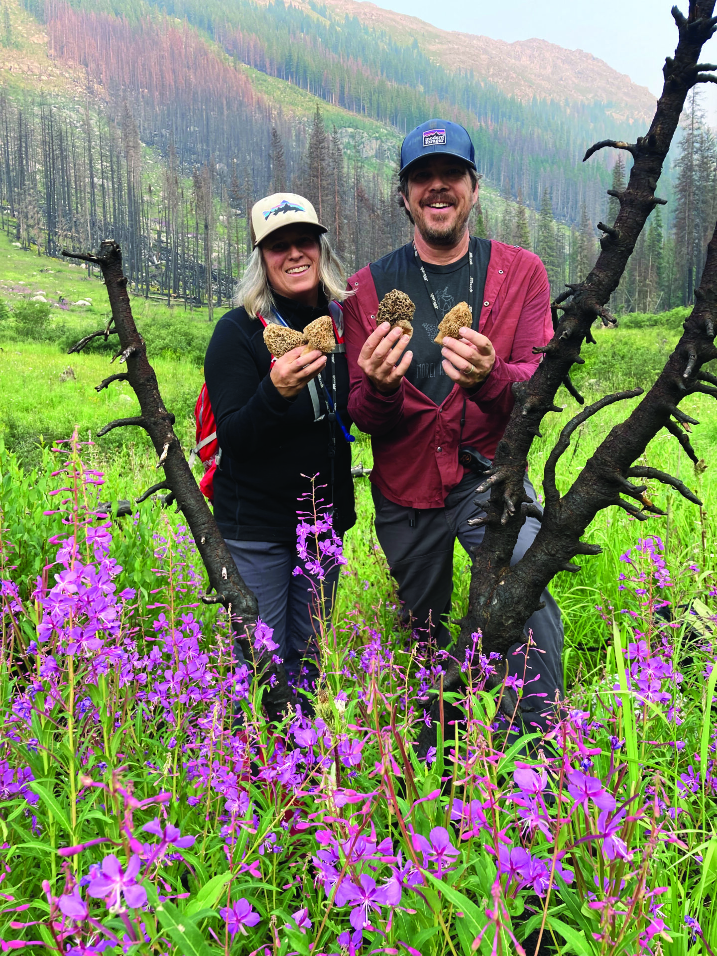 KRISTEN AND TRENT BIZZARD holding morels found in a local burn (Morchella species), they refer tothem as "burn morels."