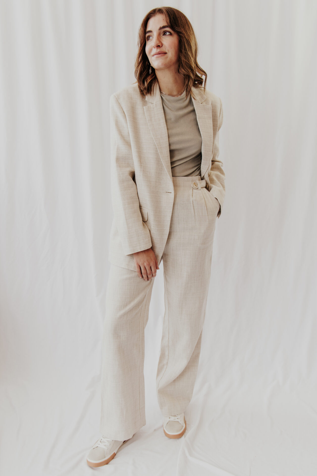 Model wearing blazer and trousers.